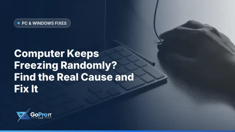 Hand resting on a computer mouse beside a keyboard on a desk
