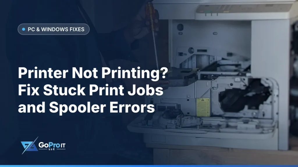 Technician servicing an open office laser printer with a screwdriver