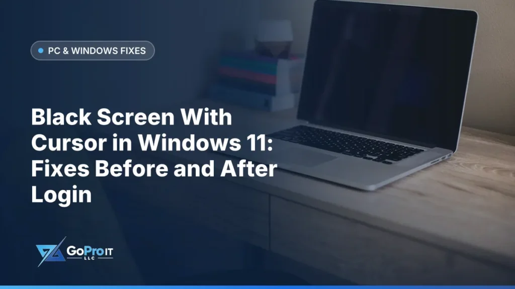 Open laptop with a black, blank screen on a wooden desk