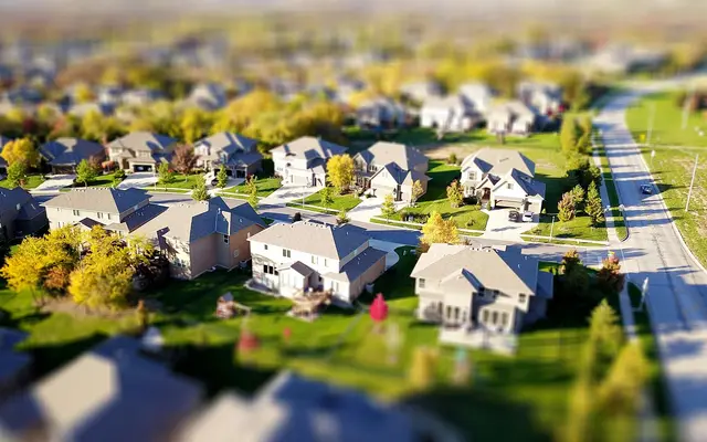Aerial view of a suburban neighborhood with rows of family homes